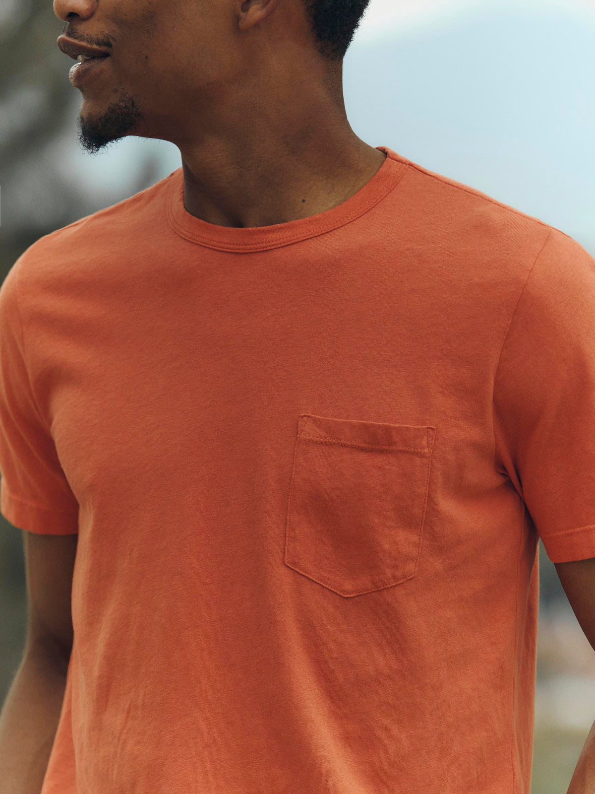 faded orange knit pocket tee